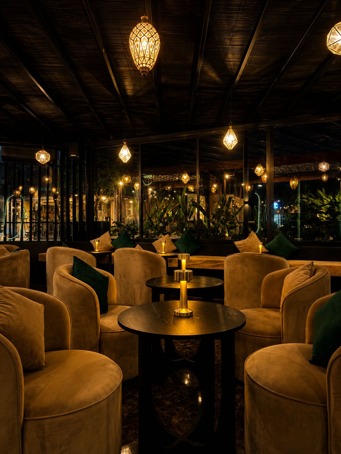 Velvet lounge chairs under lantern light